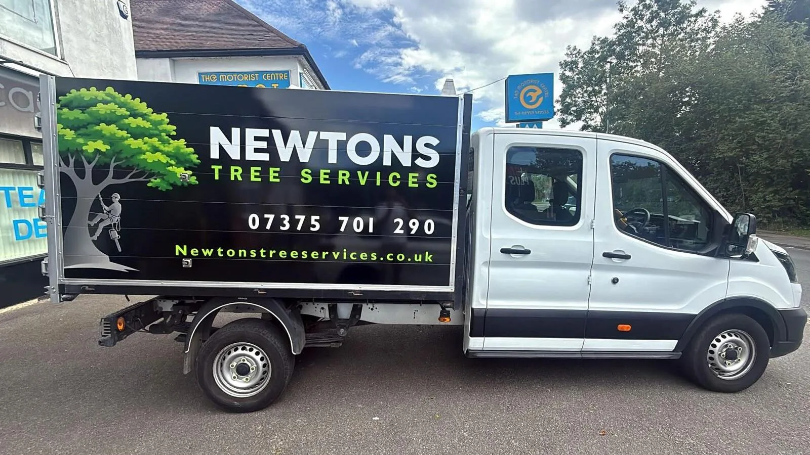 Signwritten Newton's Tree Services tipper truck used by the Oxted tree surgery crew